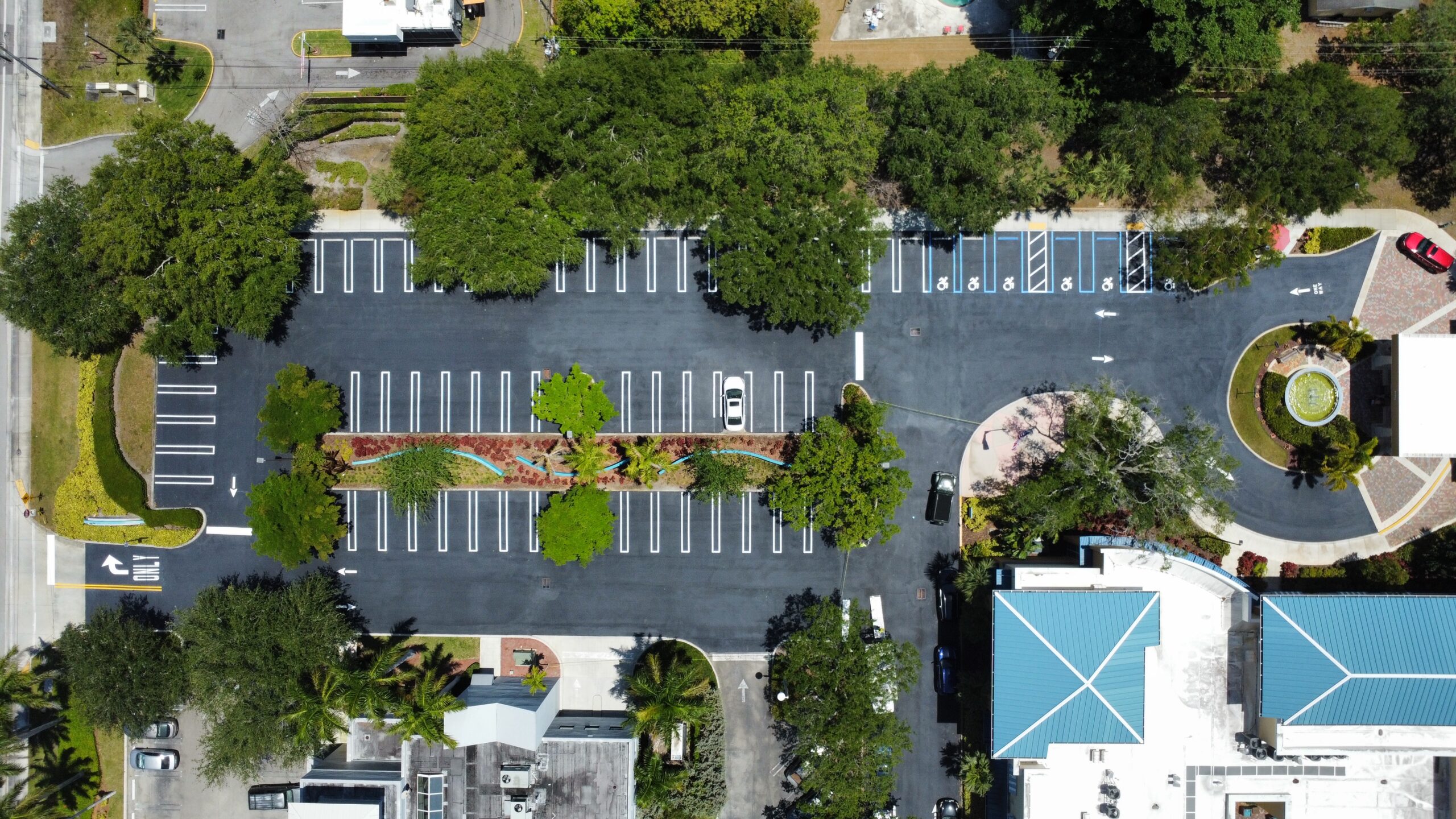 A top down view of a parking lot that was striped by 1-800-Striper Of Providence