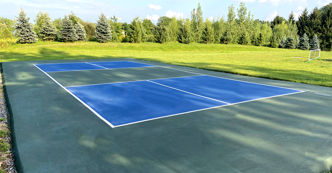 Freshly painted pickleball court with clear boundary and service lines in Northern Virginia
