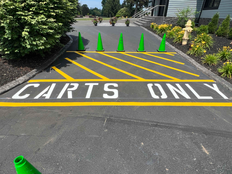 Not faded yellow and white parking lot striping lines.