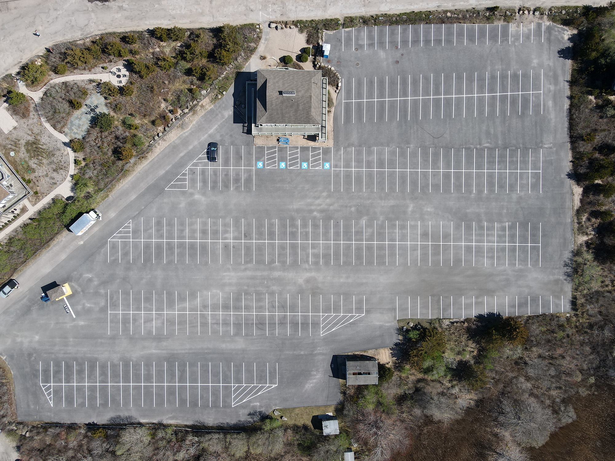 1-800-STRIPER | Why Parking Lot Restriping Gives the Best ROI An aerial picture of the parking lot at Charlestown Town Beach in Rhode Island