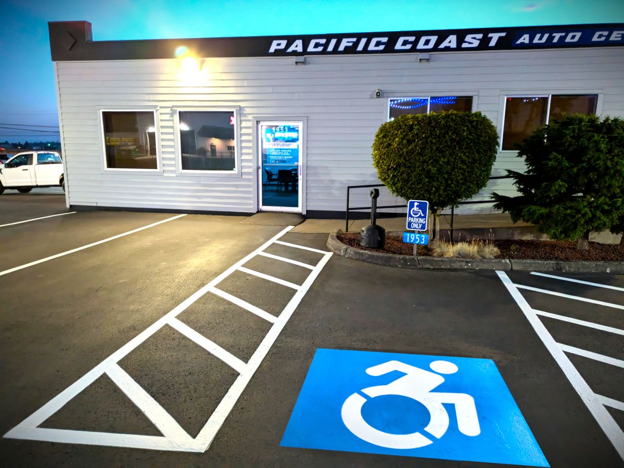 1-800-STRIPER | Parking Lot Striping in Burlington, WA Parking Lot Striping and blue ADA stalls for a used car dealership called Pacific Coast Auto Center in Burlington, WA