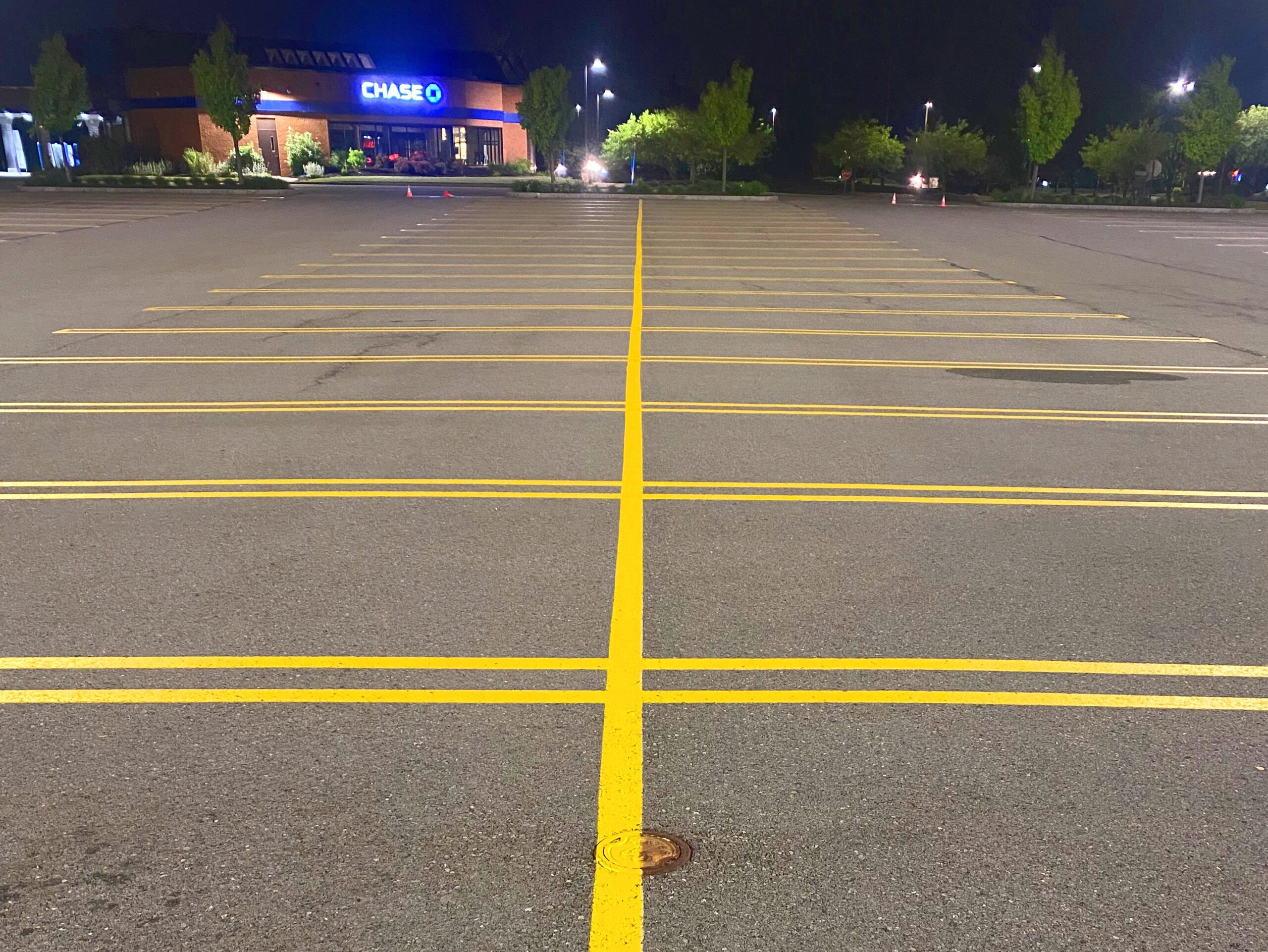 yellow parking lot line painting on black asphalt in Mt. Vernon Washington