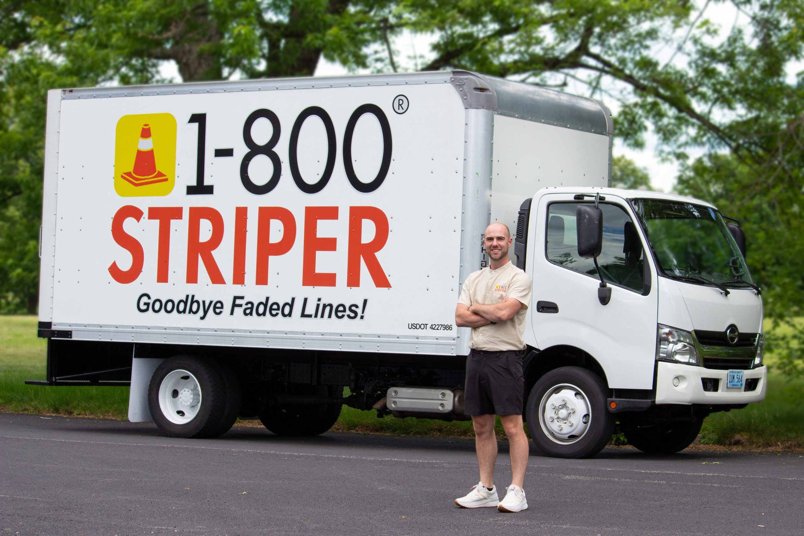 A picture of a 1-800-Striper of Providence box truck