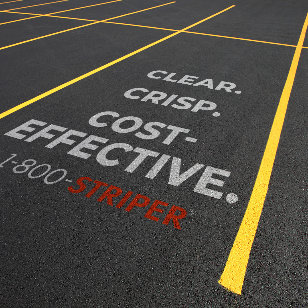 A parking stall with a marketing message painted by 1-800-STRIPER of Providence