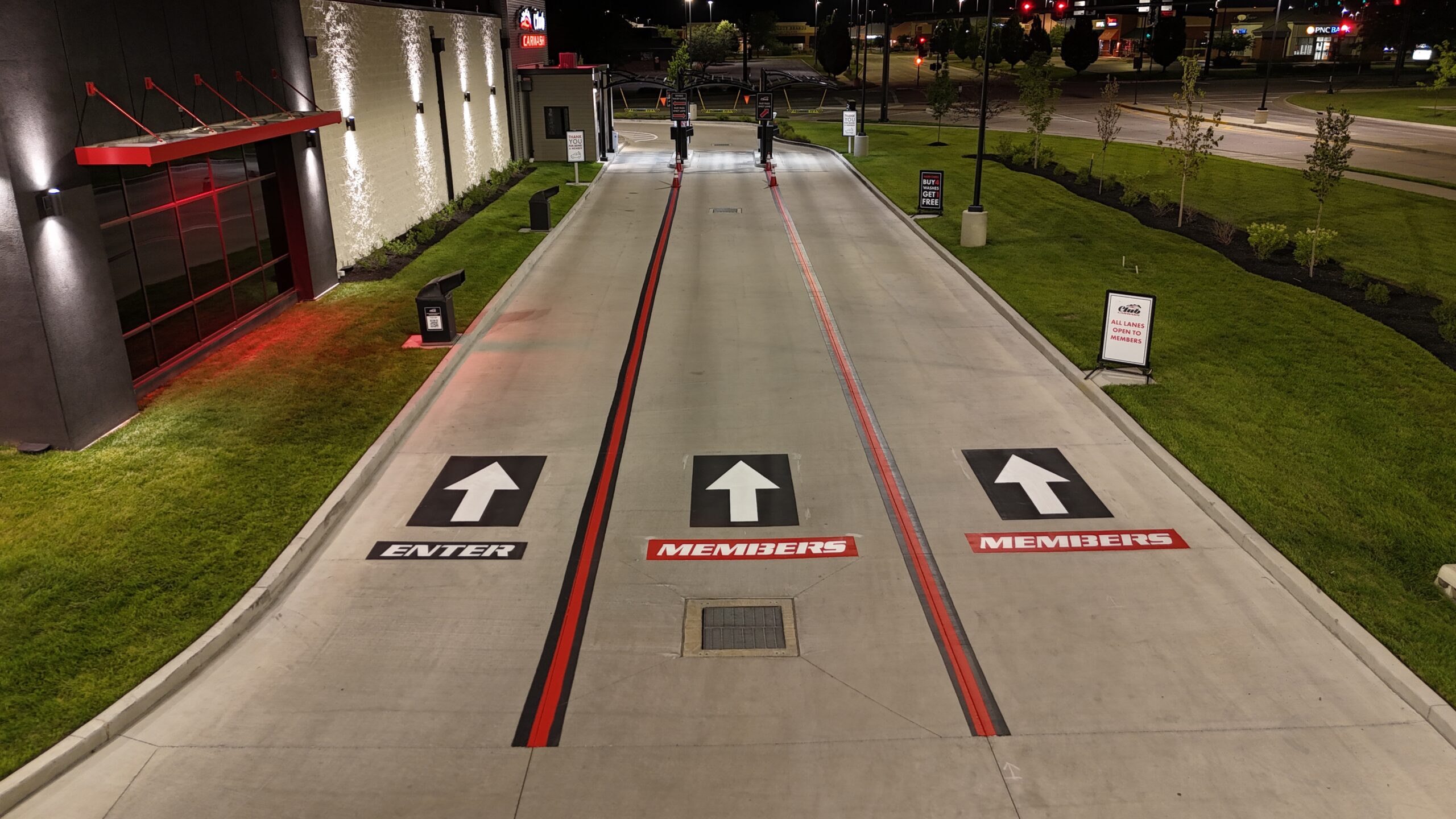 Red and black parking lot striping in downtown Seattle with black and white arrows