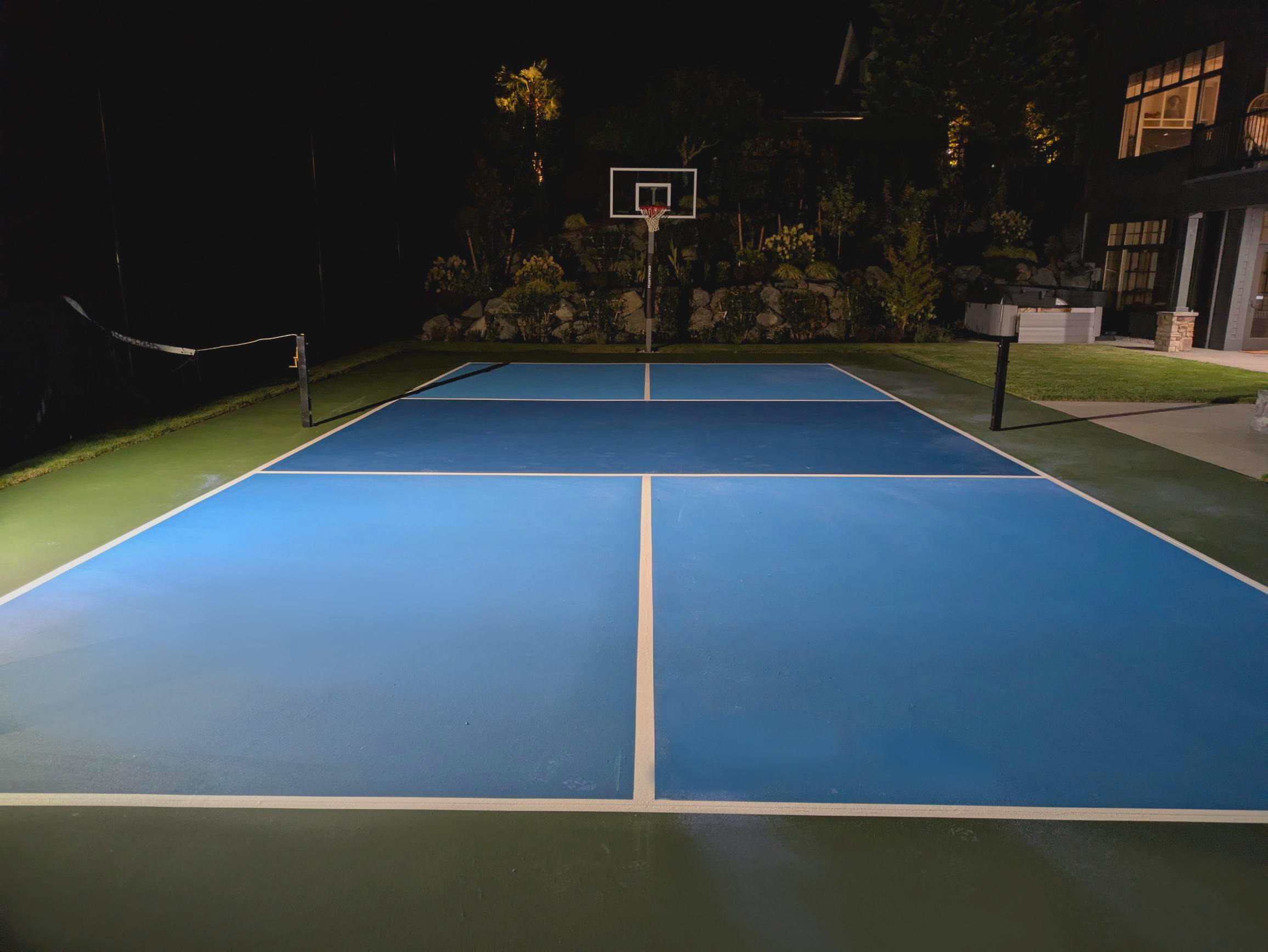 1-800-STRIPER | Professional Sport Court Painting in Redmond, WA light blue and dark blue resurfaced and painted pickleball court in redmond, wa
