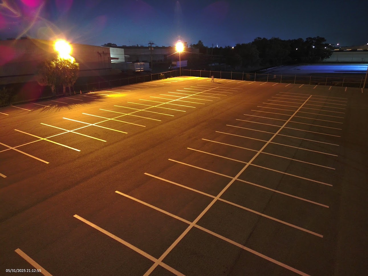 1-800-STRIPER | Sealcoating in Redmond, WA Parking lot with yellow line striping and fresh sealcoating in Redmond, WA