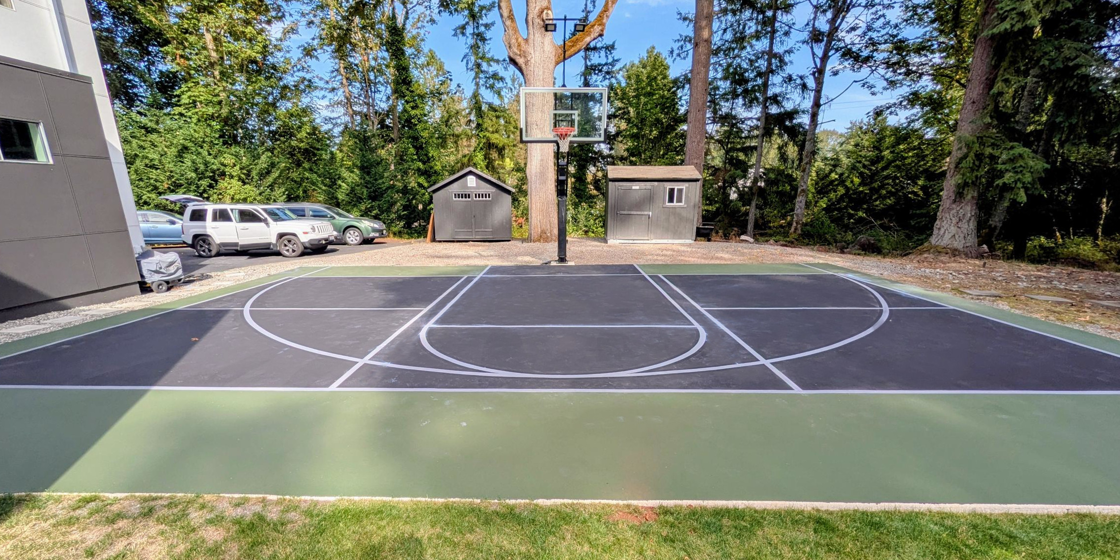 Pickleball and tennis court painting and surfacing in Medina, WA. Made with black, grey, and green paint